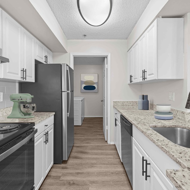 The Park at Veneto - Modern Kitchen Featuring White Cabinets